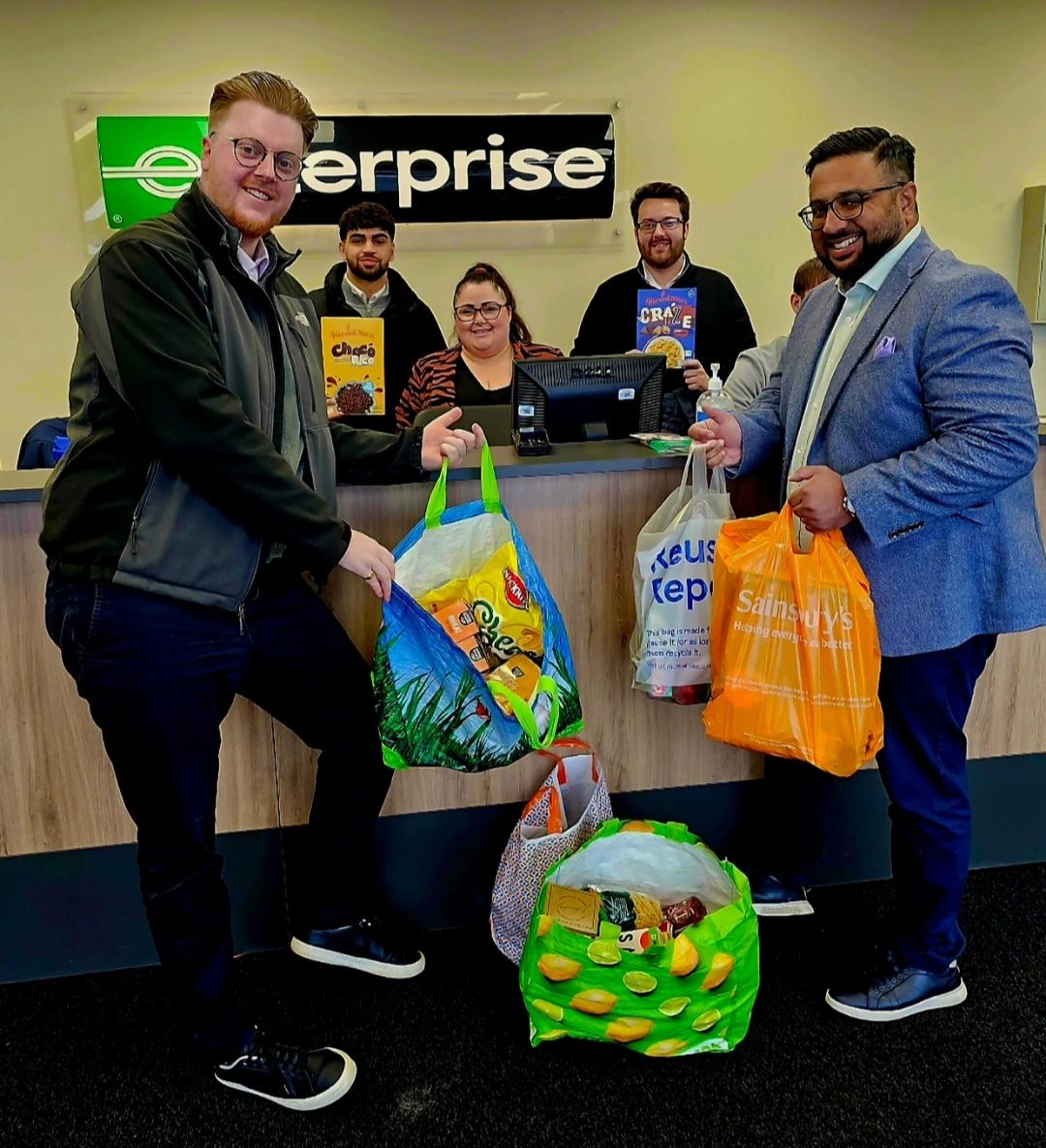 Shona King (centre) collecting food for The Gingerbread Centre